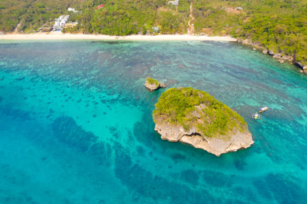 istock Ilig Iligan Beach. White sand beach and clear coral lagoon 1161164769