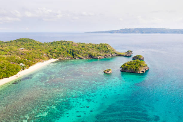 istock Small rocky island in the blue lagoon, view from above 1161164800