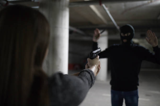 istock Woman with gun for self defense 1161166239