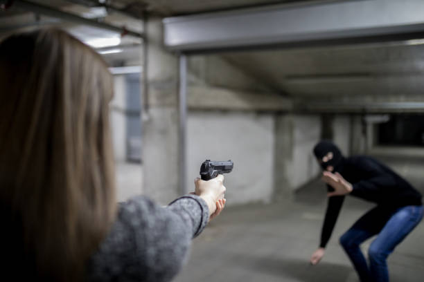 istock Woman with gun for self defense 1161166300