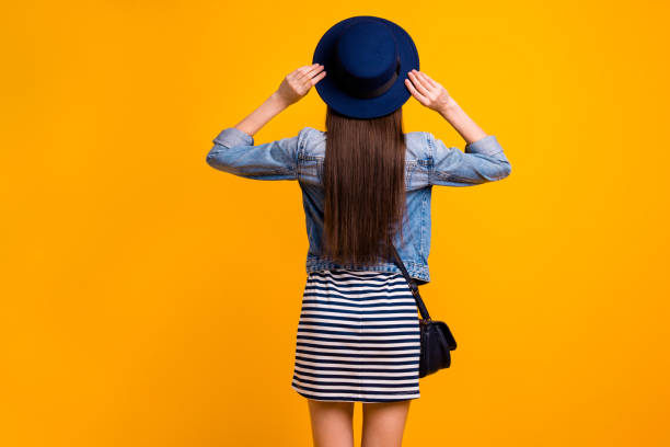 istock Rear back behind view portrait of her she nice-looking attractive content successful straight-haired lady luxurious brand clothes isolated over bright vivid shine yellow background 1161166303