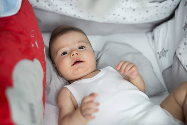 istock Cute baby boy is waking up 1161168578