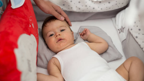 istock Cute baby boy is waking up 1161168608