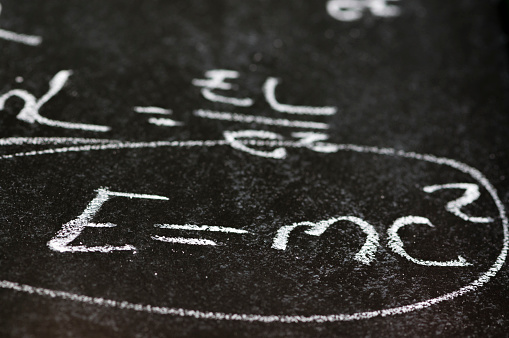 Mathematical derivation of E=mc^2 on a blackboard