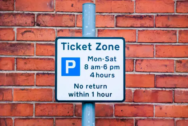 Photo of Sign warning customers that this is a ticket parking zone.