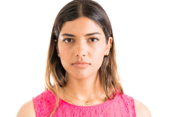 istock Woman With Blank Expression Against White Background 1161172606