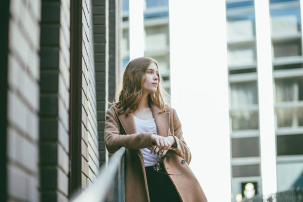 istock Young businesswoman day dreaming. 1161176429