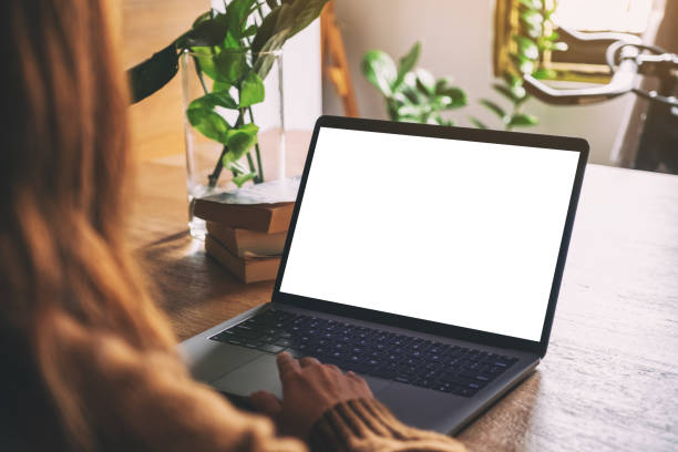 istock a woman's hand using and touching on laptop touchpad with blank white desktop screen 1161176631