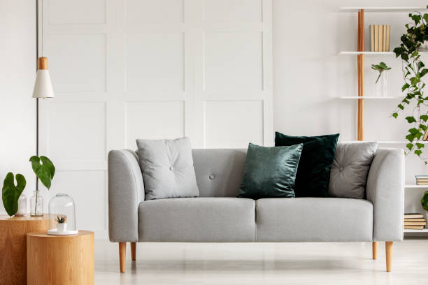 istock Designed gray couch with wooden legs in modern interior 1161177013