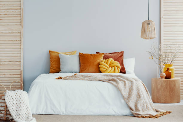 istock Warm blanket on white duvet in cozy bedroom interior 1161177993