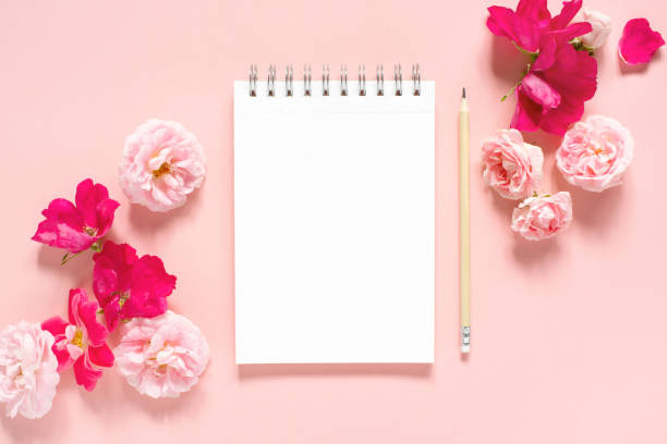 istock Natural template with blank notepad and various vintage roses 1161178063