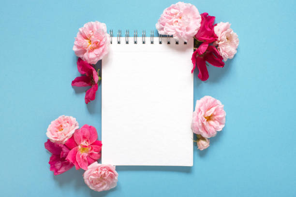 istock Natural template with blank notepad and various pink vintage roses 1161178067