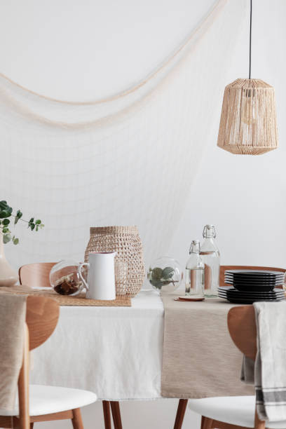 istock Rattan lamp above table in rustic dining room 1161178214