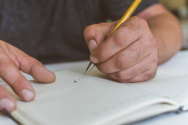 istock a person makes an entry in a notebook for doing business 1161182371