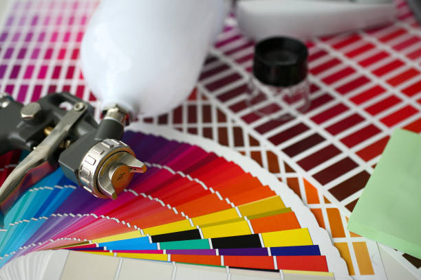 istock Closeup view of airbrush gun lying at colour check 1161182507
