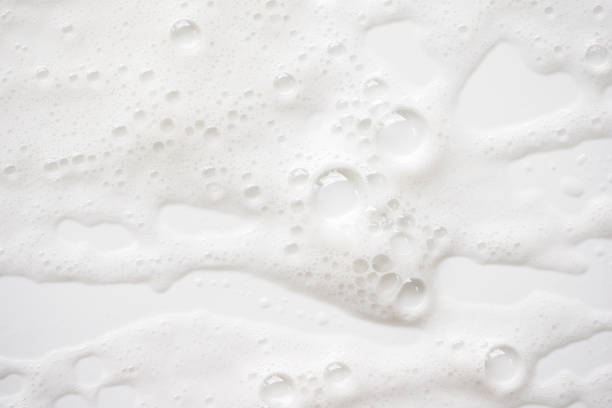 istock Abstract background white soapy foam texture. Shampoo foam with bubbles 1161183651