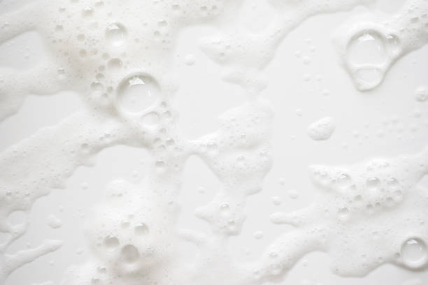 istock Abstract background white soapy foam texture. Shampoo foam with bubbles 1161185070