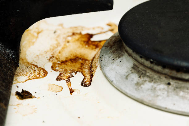 istock dirty white kitchen stove close-up 1161186466