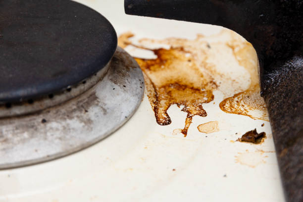 istock dirty white kitchen stove close-up 1161186499