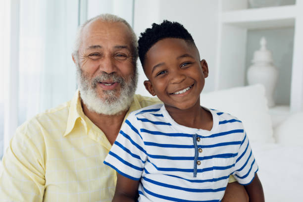 istock Grandfather and grandson smiling 1161186884