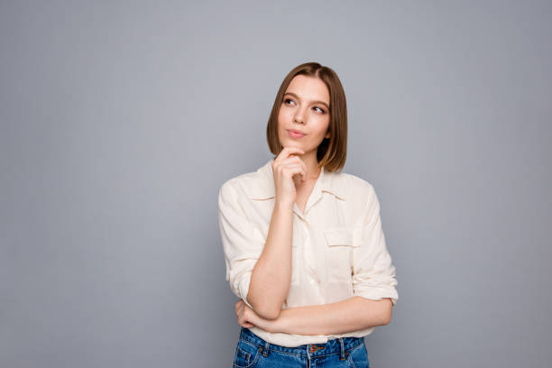 portrait of charming nice youth work worker touch finger palms hands look have thoughts dressed fashionable modern youth clothes outfit isolated grey background - pensativo imagens e fotografias de stock