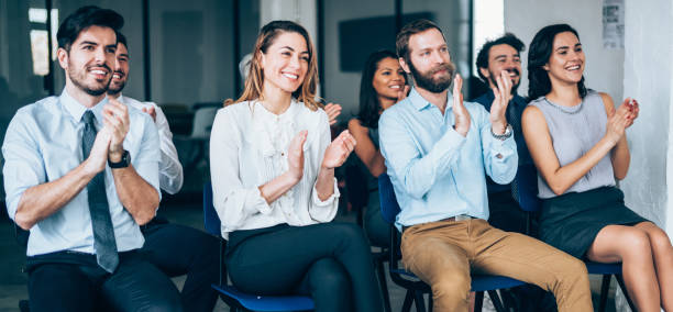 istock Audience Applauding Speaker At Business Conference 1161187866