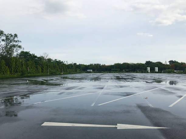 istock empty outdoor parking lot at rainy day 1161189619