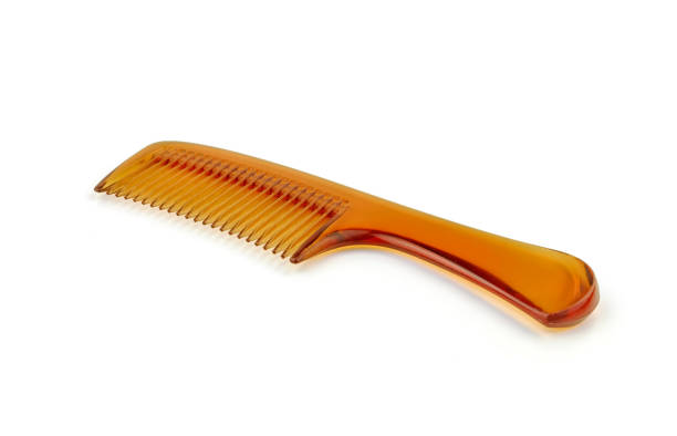 istock hair comb on white background 1161189661