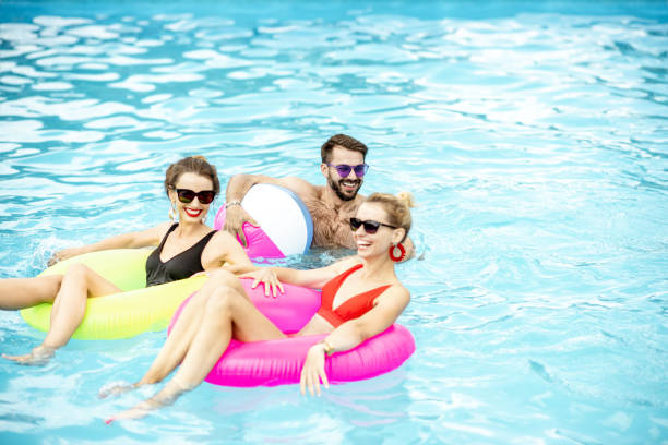 istock Friends in the swimming pool 1161190717