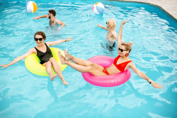 istock Friends in the swimming pool 1161190724