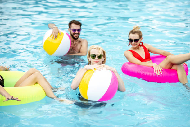 istock Friends in the swimming pool 1161190729