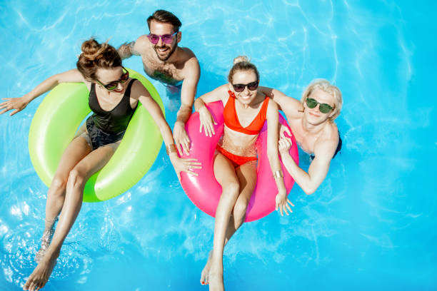 istock Friends in the swimming pool 1161190821