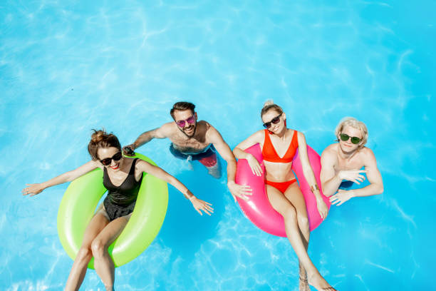 istock Friends in the swimming pool 1161190824