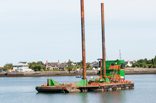 A floating barge for construction works at a harbour