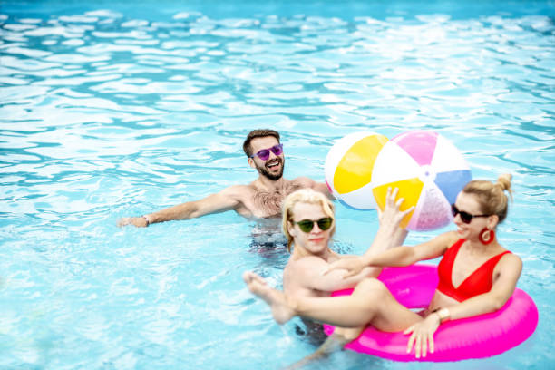 istock Friends in the swimming pool 1161190865