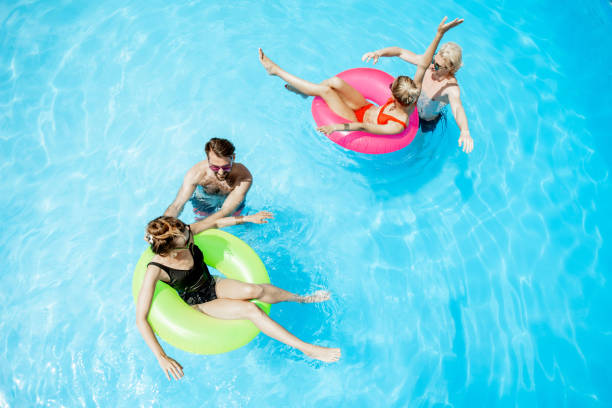 istock Friends in the swimming pool 1161190867