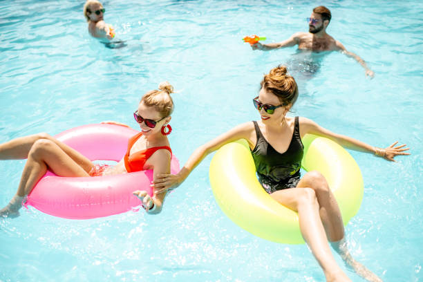 istock Friends playing in the swimming pool 1161190978