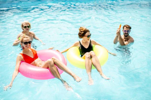 istock Friends playing in the swimming pool 1161190984
