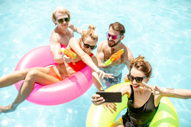 Friends playing in the swimming pool