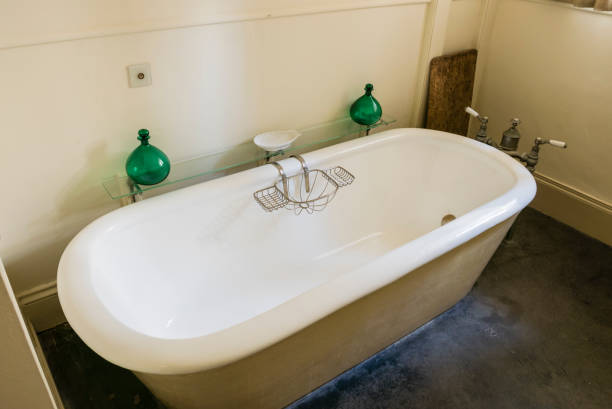 istock Victorian style 'rolltop' bath in an old fashioned bathroom 1161191415