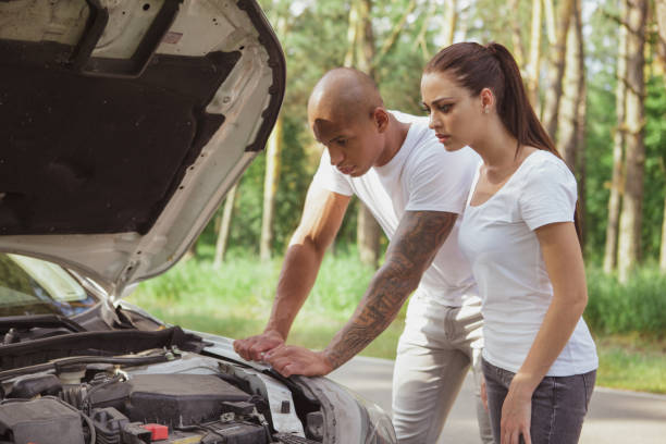 istock Lovely mixed couple on a road trip by car 1161191444