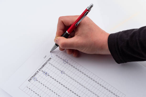 istock Entrance examination list - filled paper with pen. Printed document. 1161193006