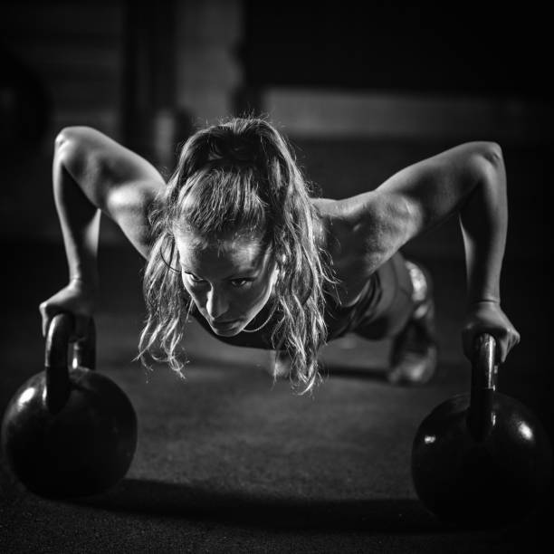 istock Woman athlete exercising with kettlebell 1161194282