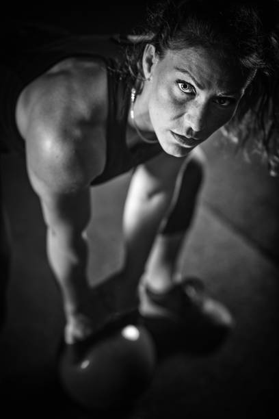 istock Woman athlete exercising with kettlebell 1161195187
