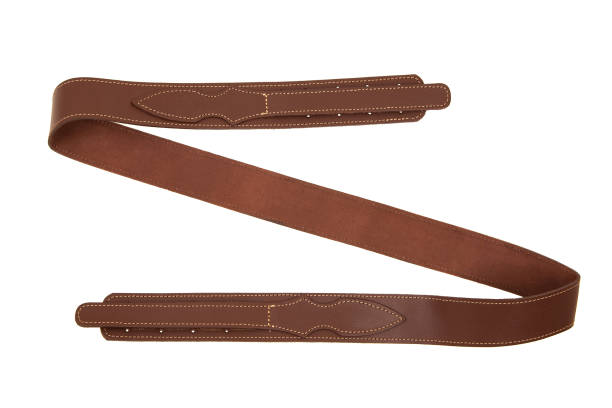 istock Brown leather shoulder strap for a gun isolated on white background 1161197662