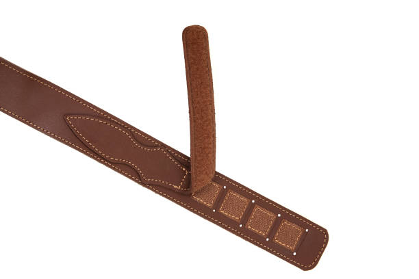 istock Brown leather shoulder strap for a gun isolated on white background 1161197801