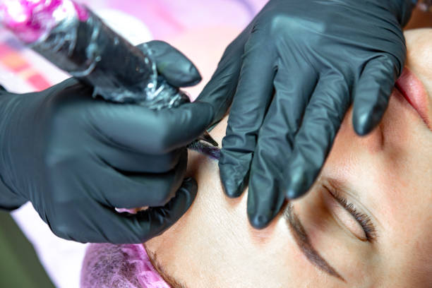 istock Permanent makeup procedure. Eyebrow make up. Brow tattoo. Close up, selective focus. 1161198767