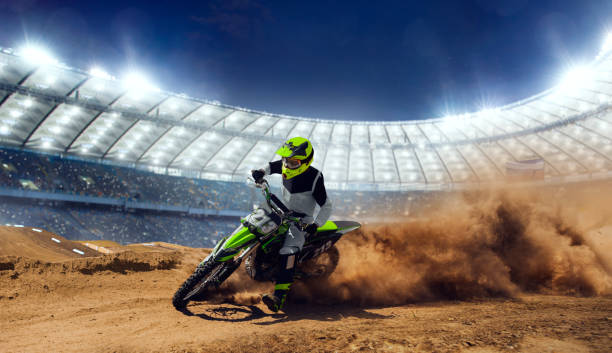 Motocross riders in action. Motocross riders in action. Supercross. Motocross sport. motorcycle racing stock pictures, royalty-free photos & images