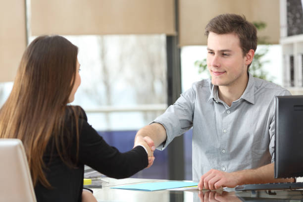 istock Serious businesspeople handshaking at office 1161199460
