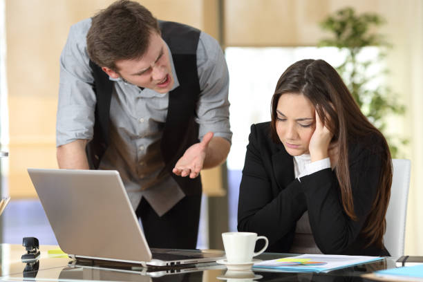 istock Businessman harassing at intern at office 1161199938